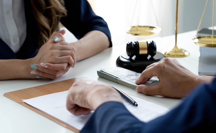 Close-up shot, A male client giving a house loan payment or mortgage fees to his female real estate agent. Property Investment concept